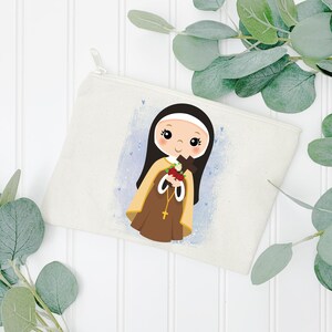 May include: A white canvas zippered pouch with a colorful illustration of a young girl in a brown and white habit holding a cross and flowers. The girl has brown hair and brown eyes. The background is a light blue with white dots.