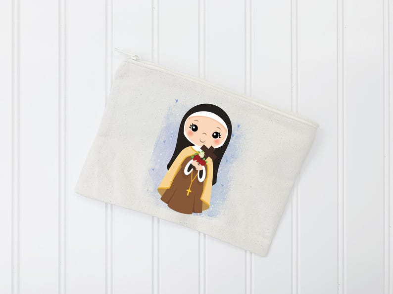 May include: A white canvas zippered pouch with a colorful illustration of a young girl wearing a brown and white habit and holding a bouquet of flowers. The girl has dark hair and brown eyes.