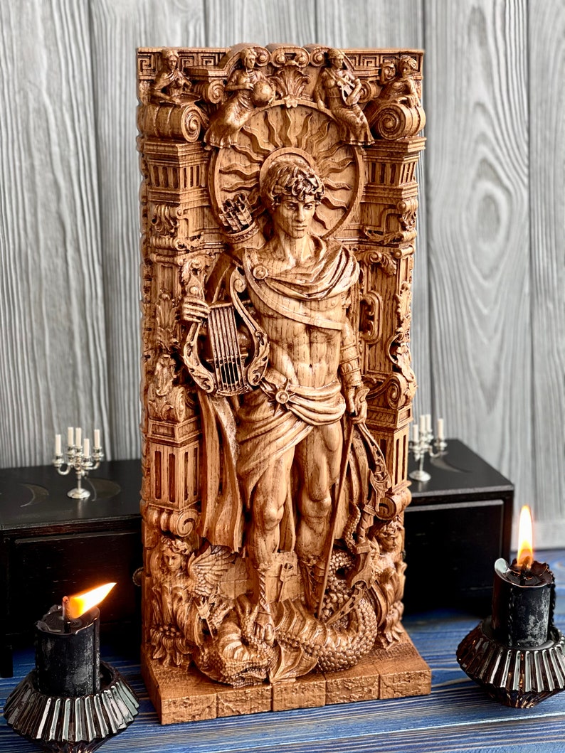 May include: A wooden sculpture of a male figure with a lyre and a staff, standing on a base with a dragon design. The sculpture is surrounded by intricate carvings of flowers, leaves, and other decorative elements.