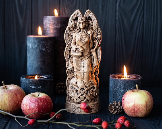 Idunn goddess of youth in Asatru, linked with Seidr Volva traditions. Idunn statue - keeper of apples. Norse statue of fertility and renewal