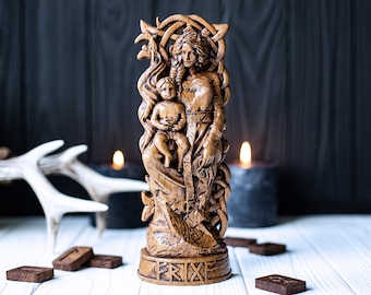May include: A detailed wooden statue depicting a woman holding a child, with intricate carvings and a weathered finish. The base of the statue features engraved text. The background includes candles and wooden runes, creating a mystical ambiance.