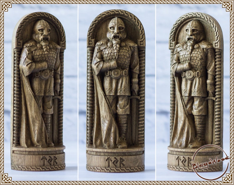 May include: A wooden carving of a Viking warrior with a sword and shield, standing in a carved wooden frame. The carving is detailed and realistic, with intricate details on the warrior's armor and weapons. The base of the carving is inscribed with runes.