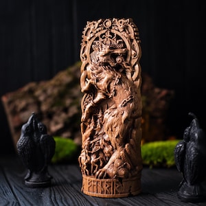 Carved wooden Fenrir statue – Fenrir the old wolf from North mythology and the Poetic Edda. Dire wolf shows scene of ragnarok Hati and Sköll