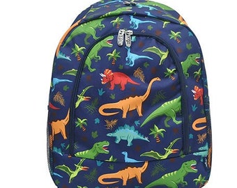 May include: A blue backpack with a dinosaur print. The backpack features a variety of dinosaurs in different colors, including green, orange, red, and blue. The backpack has two zippered compartments and a mesh side pocket.