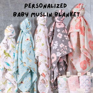 May include: Five personalized baby muslin blankets in various colors and patterns. The blankets feature dinosaurs, animals, and floral designs. The text "PERSONALIZED BABY MUSLIN BLANKET" is printed at the top of the image.