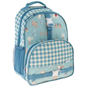 May include: A teal backpack featuring a western-themed pattern of horses, cowboy boots, windmills, and fences. The bag has a blue and white gingham check trim, a top handle, side mesh pockets, and two front compartments secured with white plastic buckles.