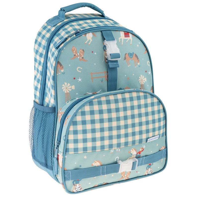 May include: A teal backpack featuring a western-themed pattern of horses, cowboy boots, windmills, and fences. The bag has a blue and white gingham check trim, a top handle, side mesh pockets, and two front compartments secured with white plastic buckles.