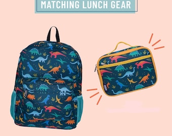 May include: A dark blue backpack and a matching rectangular lunch bag, both featuring a colorful dinosaur pattern. The text "MATCHING LUNCH GEAR" appears above the items. The backpack has side mesh pockets, and the lunch bag has a yellow handle.