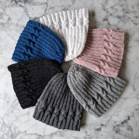 Handknit cable beanie hats in reflective yarn; ideal winter hats for dark nights