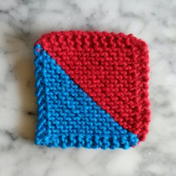 Knitted coasters: diagonal graphic red & blue wool coasters. Chunky wool. Made in Ireland. Matching place mats available. Home gift.