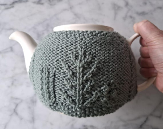 Teacozy knitting pattern: forest theme cable teacosy for Aran or worsted yarn