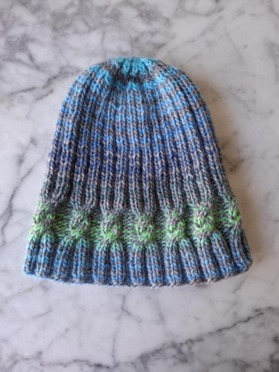 Knit beanie hat: original design in soft yarn. Made in Ireland, the simple cable beanie is striped in blue, green and grey.