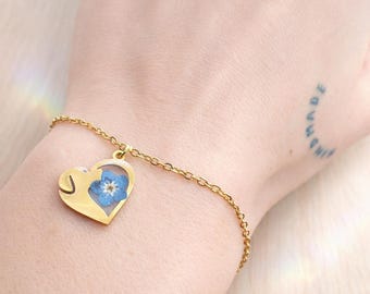 Dog heart memorial bracelet. Real forget-me-not resin flower. Adjustable steel jewelry, one size fits all. Gift idea for dog lovers.