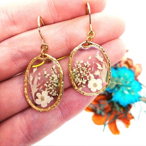 Women's gold brass pendant hoop earrings with real resin flower pendant. Pressed dried flower resin jewelry. Unique gift for her