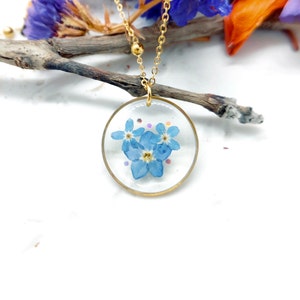 Forget me not real flower necklace in resin. Hypoallergenic steel circle pendant. Resin jewelry. Gift for friends.