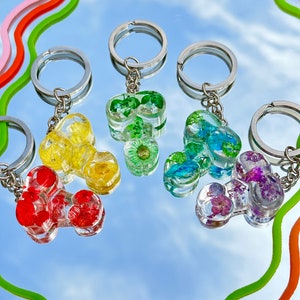 Llavero peny arco iris floral lgbtq+. Llavero para casa, coche, amuleto de la suerte. Accesorios florales. Idea de regalo para despedida de soltera.