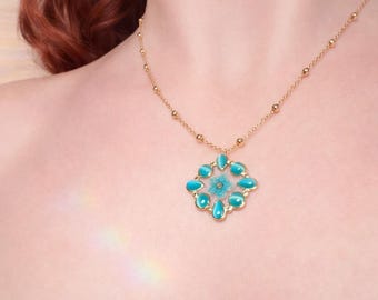 Handcrafted necklace with turquoise gemstone pendant, gold, and real flower. Resin jewelry. Gift for a friend. Gift for a girlfriend. Handmade jewelry.