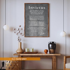 a wooden table with a vase of flowers, candles, and a black vase, along with a framed quote in black text on a white background.
