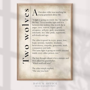 A framed print with text and illustrations of two wolves, one evil and one good, with a boy thought about a minute and asking his grandfather about the wolf question.