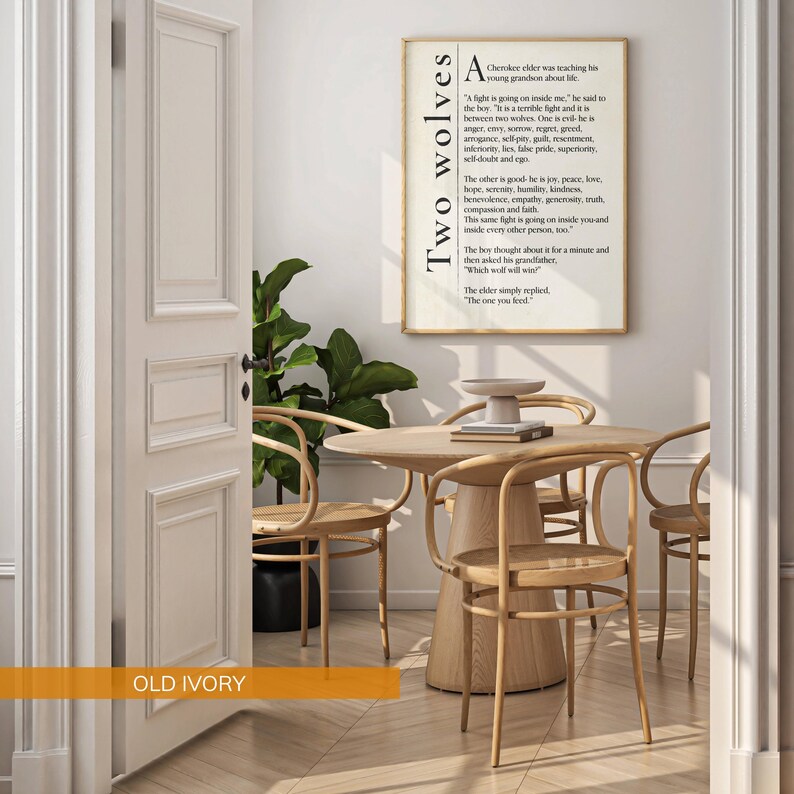 a cozy and inviting living space with a wooden table and chairs, a potted plant, and a framed quote on the wall.