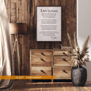 a wooden dresser with a framed poem, a lamp, and a potted plant, all set against a wooden wall.