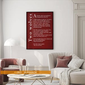 a living room with a red framed poster of a poem hanging on the wall, a white sofa, a coffee table, and a lamp.