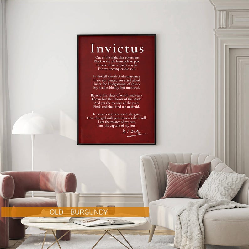 a living room with a red framed quote of the Roman soldier Marcus Aurelius, "Invictus", hanging on the wall. The room has a white sofa, a coffee table, and a lamp.