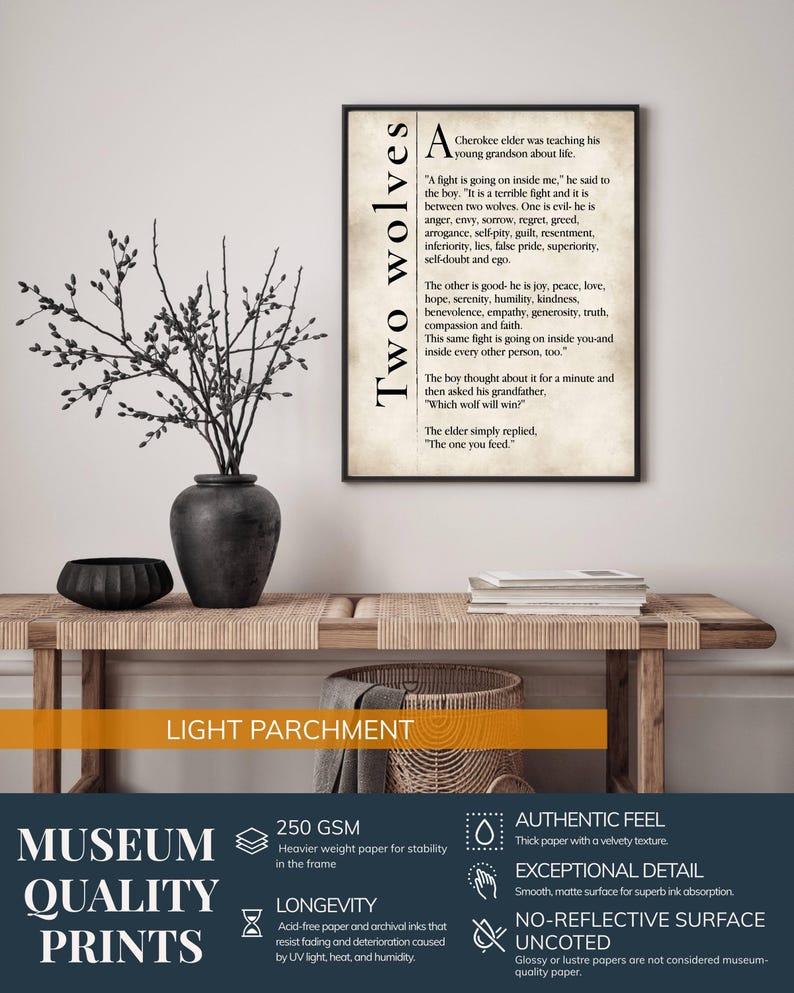 a wooden table with a vase of branches and a framed quote about the two wolves. The quote is about a young boy being taught by a Cherokee elder about the dangers of the two wolves. The quote is framed in a light-colored paper, and the image is described as a "light parchment" with a "lightness" and "quality" theme.