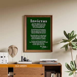 a framed quote of the Roman soldier and statesman, "Invictus", hanging on a wall above a wooden dresser with various items on it.
