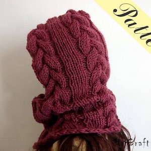 May include: A burgundy knitted cowl neck hat with a cable knit pattern.