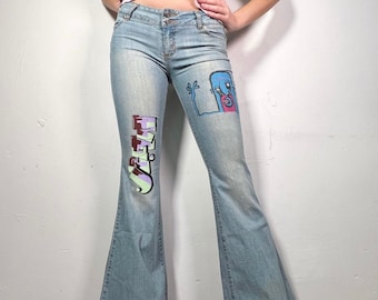 2000s monster graffiti print Stretch Light wash ultimate Y2K denim jeans