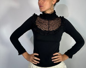 Stunning black vintage skivvy top with ruffle, cuff and high neck