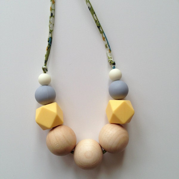 birdy and pearl nursing necklace in Liberty of London's Mitsi green - yellow, grey and cream silicone teething beads - wood teething beads