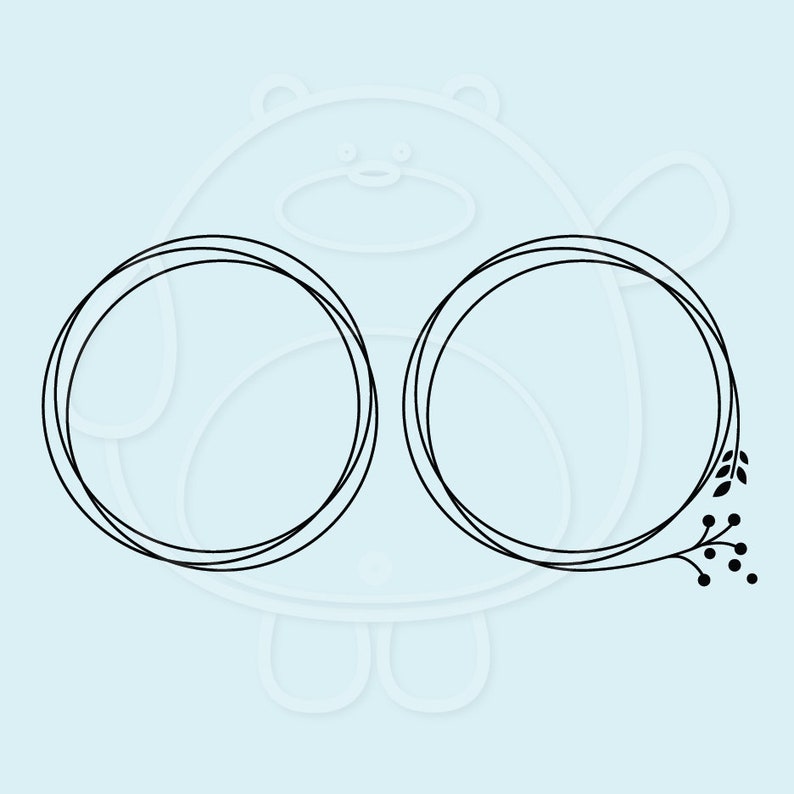 May include: Two black outlined circles with a floral design on the right side. The floral design includes a stem with leaves and berries.