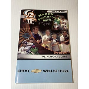 May include: A promotional flyer for a Bowie Baysox baseball game, celebrating Father's Day in 2002. The flyer features team members, the team logo, and the Chevy logo with the text "We'll Be There."