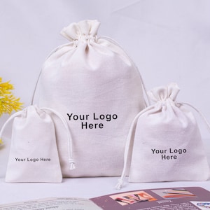 Petit sac à cordon de 100 bijoux blancs personnalisés avec logo, sac pour cadeaux de mariage, emballage de bijoux personnalisés (coton biologique, livraison gratuite)
