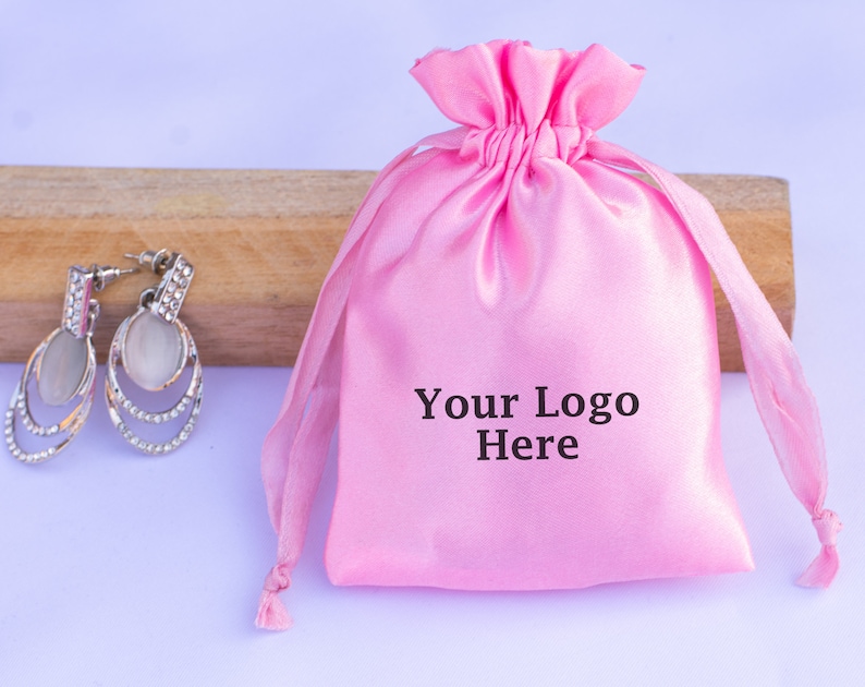 pink satin pouches with logo