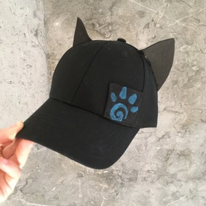 Cap with animal ears, clean design, elegant yet playful, paw print patch, black, cotton cap, EVA foam ears, Kapow tattoo studio merch