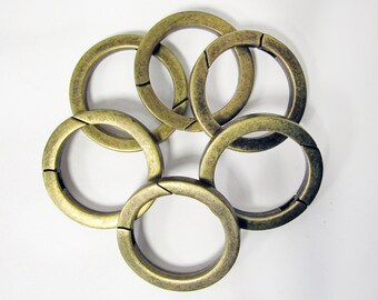 What is this antique jewelry piece with a center chain and clasp
