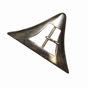 May include: A silver-toned, triangular belt buckle with a rounded shape and a central bar for the belt strap. The buckle has a polished finish and a minimalist design, suitable for various belts.