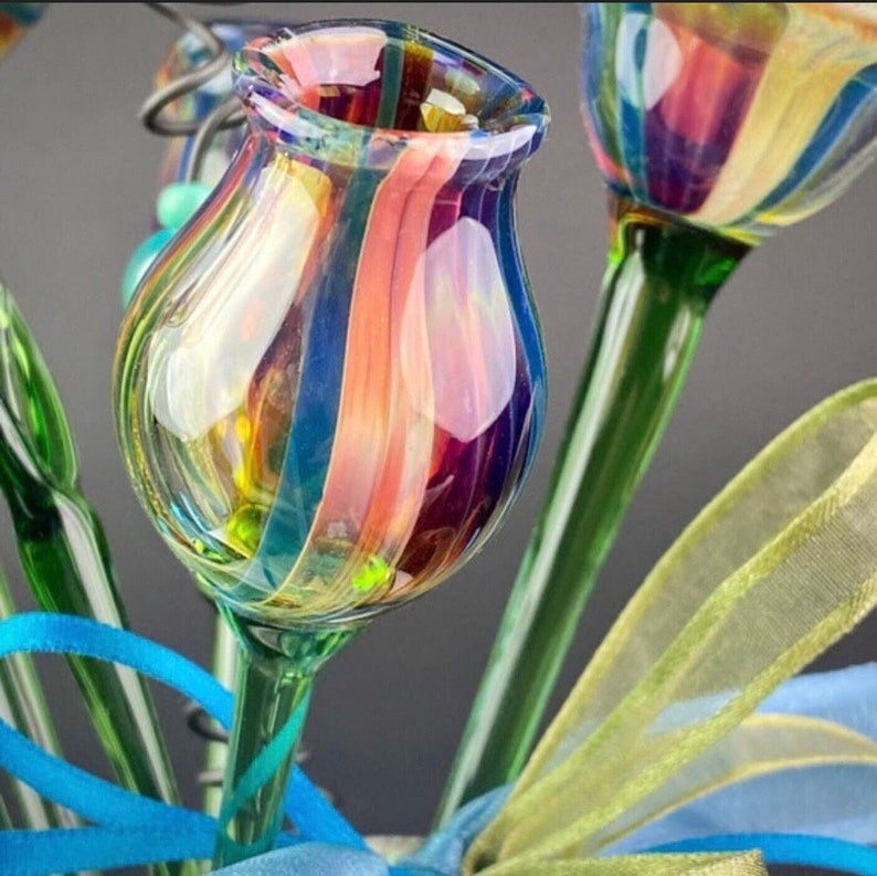 Blown glass flowers with pink, gold, blue, and purple colors.  Handcrafted in Colorado.