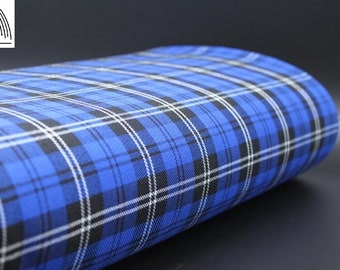 May include: A close-up of blue, black, and white plaid fabric. The fabric is folded and has a soft, textured appearance.