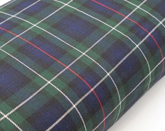 May include: Green, blue, and white plaid fabric with thin red stripes.