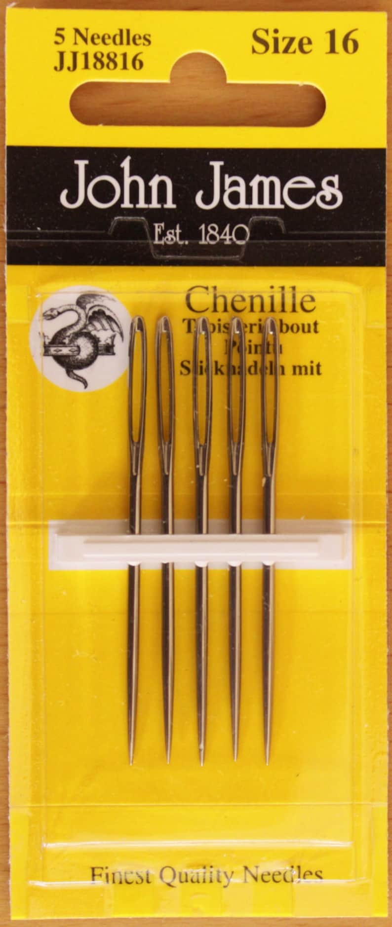 May include: A pack of five John James size 16 Chenille needles on a yellow card. The packaging features the text 5 Needles, JJ18816, Size 16, John James, Est. 1840, Chenille, and Finest Quality Needles, along with a circular logo of a dragon.