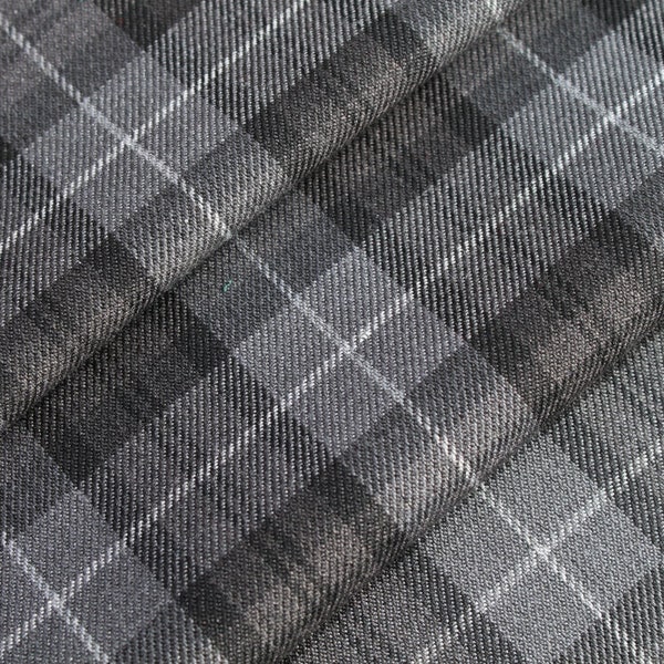 Grijze tartan stof + bijpassend garen. Tartan stof op maat gesneden.