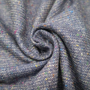 100% Wool British Blue Donegal Tweed, width 156 cm / 61’’ suitable for jackets, trousers, skirts and coats.