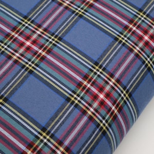 50% Red / Porcelain Cotton, 50 perc Polyester Tartan width 155 cm/61&#39;&#39;, weight 115 gsm. Tartan fabric by the metre. Plus matching thread.