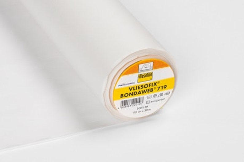 May include: A roll of white Vliesofix Bondweb 719 fusible interfacing for sewing projects. The label reads "Vliesofix Bondweb 719" and includes the size 90 cm x 30 m.