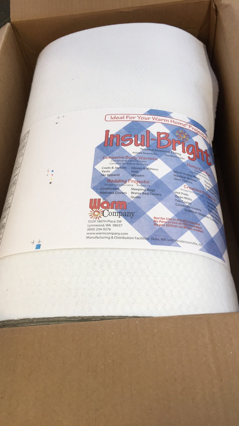 May include: A roll of white Insul-Bright needled insulated lining inside a cardboard box. The product label features a blue and white checkered pattern, the text Insul-Bright, The Warm Company, and lists various project uses and contact details.