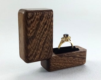Wooden engagement ring box from wenge. Wood ring holder proposal. Pocket ring case for wedding.